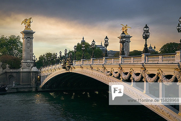 Pont Alexandre III with Petit Palais in the background at sunset