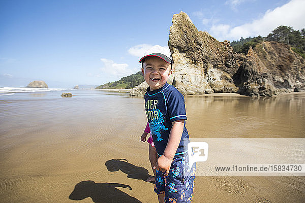 portrait of smiling happy boy at the beach.