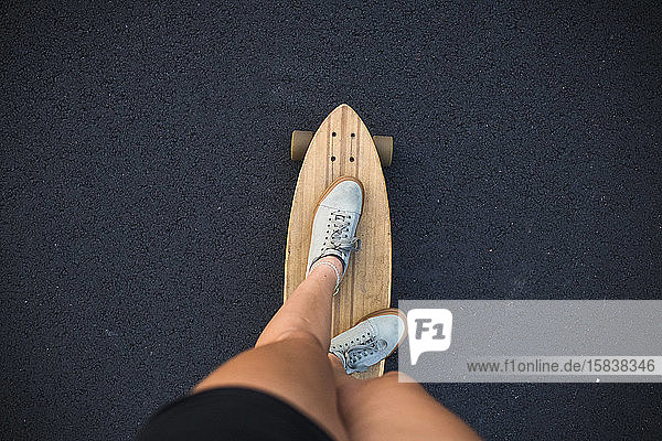 First Person POV Young Women Skateboarding in Summer