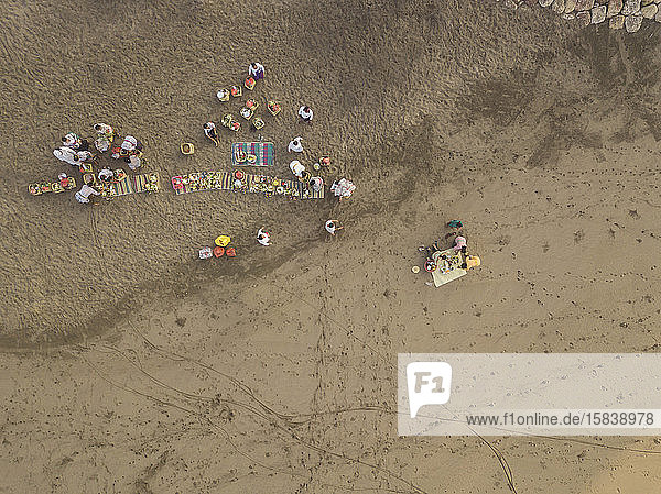 Aerial view of Balinese ceremony at the beach