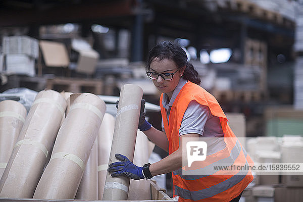 storekeeper female in a warehouse with propducts