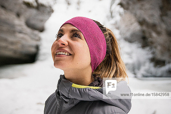 Female Hiker Enjoys Snowy Johnston Canyon Close Up