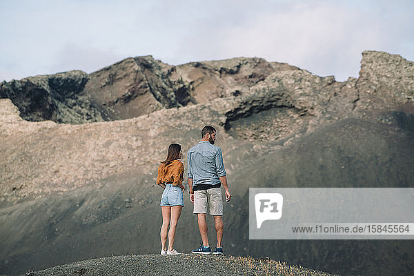 Couple looking the Volcano Cuervo in Lanzarote  Timanfaya.
