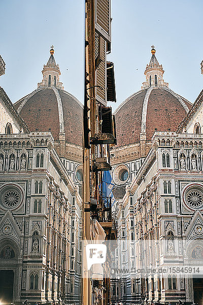 Facade of cathedral and dome with identical reflection