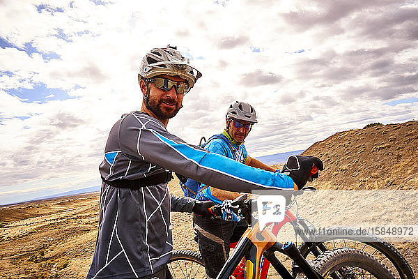 A candid portrait of two mountain bikers.
