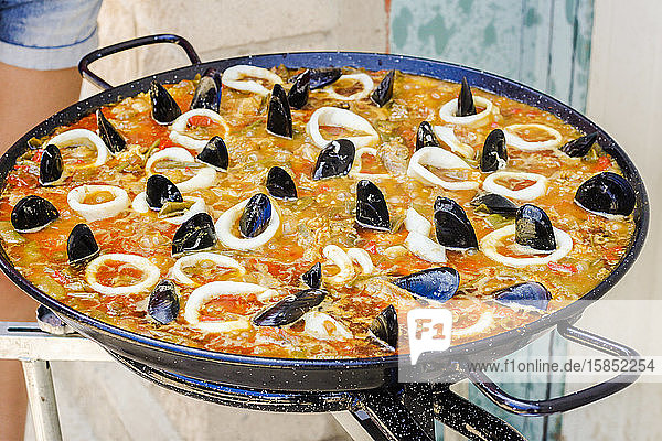 Typical Spanish seafood paella in a stove