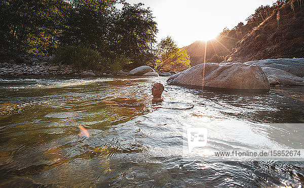 Man relaxing in the Middle Fork Kaweah River