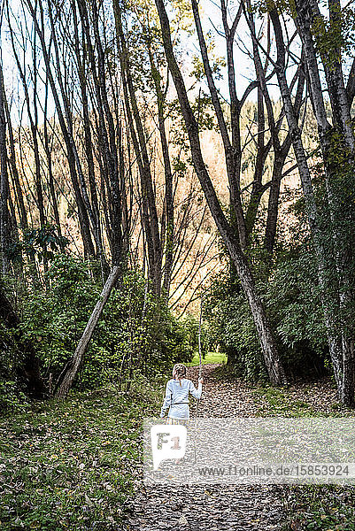 Tween girl hiking in New Zealand forest