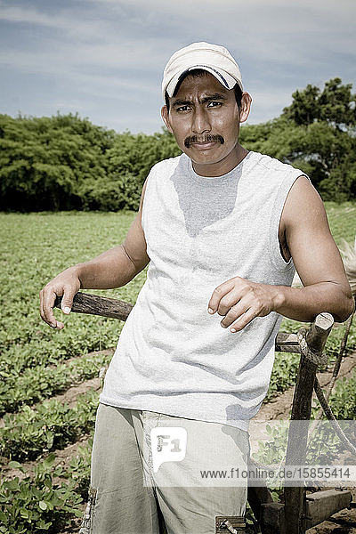 Portrait of male farmer working the field  with a strong look  work day.