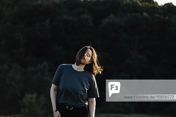 Beautiful portrait of a young stylish woman on a sunny day in au
