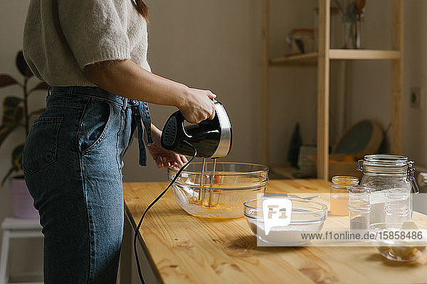 Young woman making Christmas cookies