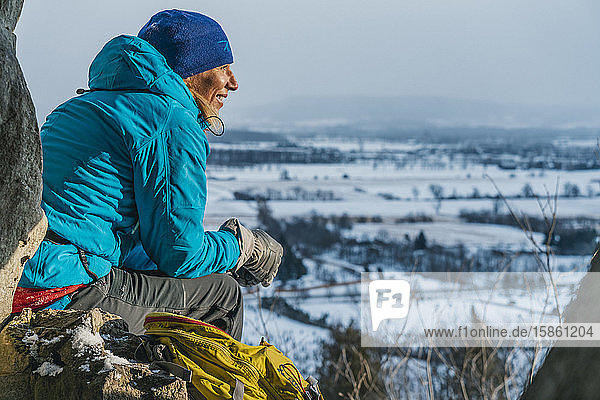 Enjoying Warm Sun Rays on Cold Day After Climbing