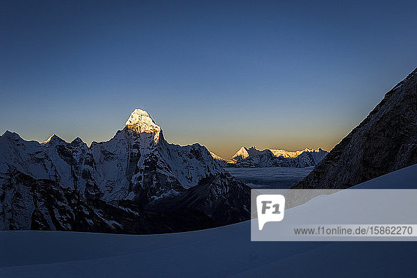 Alpine sunset over the mountains with Ama Dablam in the Himalaya