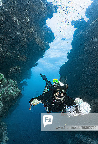 scuba diver exploring a canyon at the great barrier reef in Australia