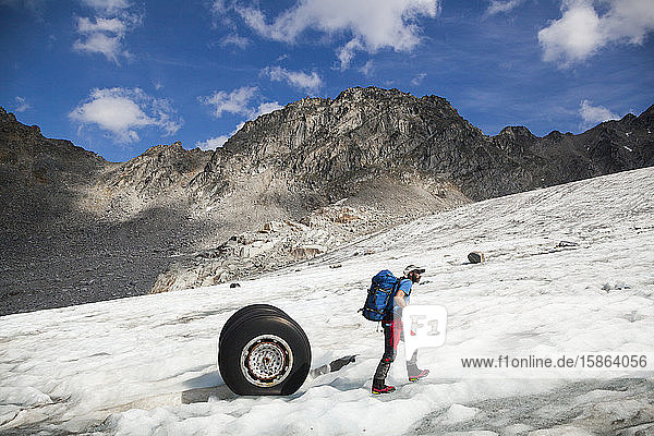 Man at airplane crash  Bomber Glacier  Talkeetna Mountains  Alaska