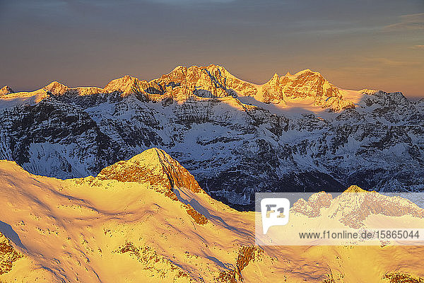 Aerial view of peak Baroni and Bernina Group at sunset Masino Valley Valtellina Lombardy Italy Europe