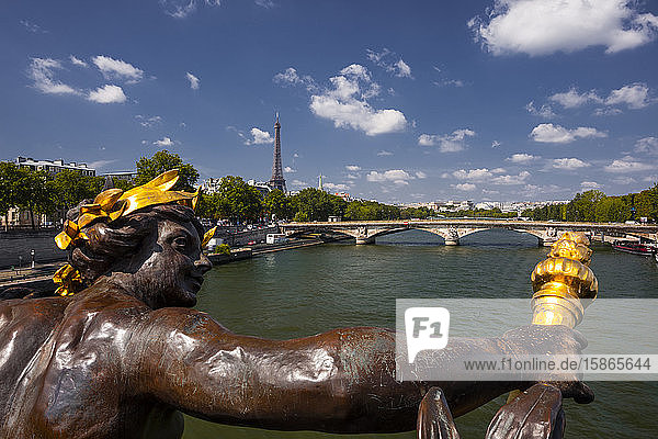 Looking down the waters of the River Seine in Paris towards the Eiffel Tower from Pont Alexandre III  Paris  France  Europe