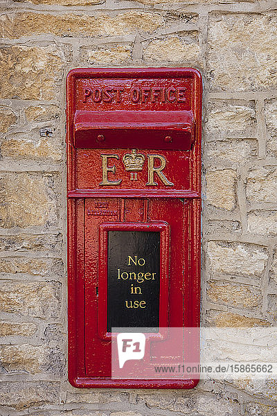 An old postbox that is no longer in use at Castle Combe in Wiltshire  England  United Kingdom  Europe