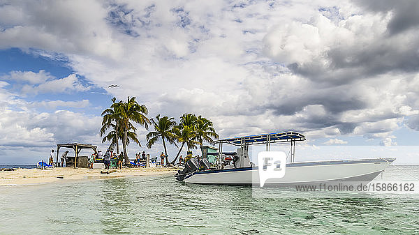 Boat moored at Silk Caye  Marine Reserve  Caribbean Ocean; Belize