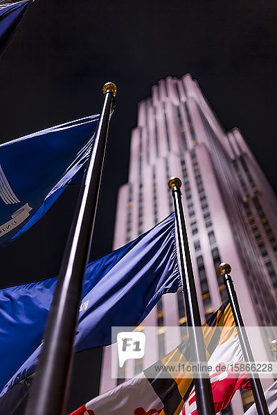 Americas Tower and illuminated international flags at night; New York City New York United States of America