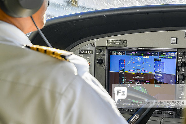 Pilot in a plane cockpit; Belize