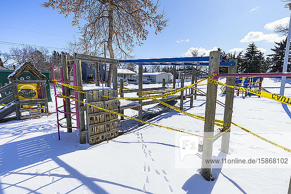 A playground cordoned off with caution tape during the COVID-19 World Pandemic; Edmonton Alberta Canada