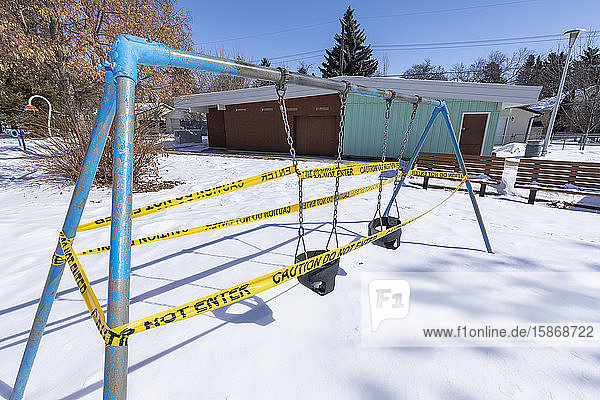 A playground cordoned off with caution tape during the COVID-19 World Pandemic; Edmonton Alberta Canada