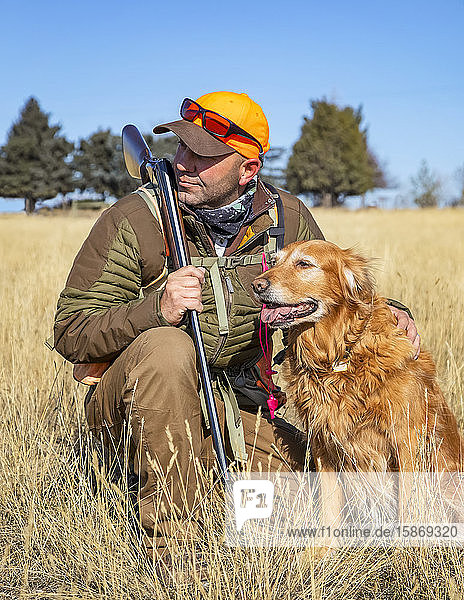 Man hunting with his dog; Denver Colorado United States of America