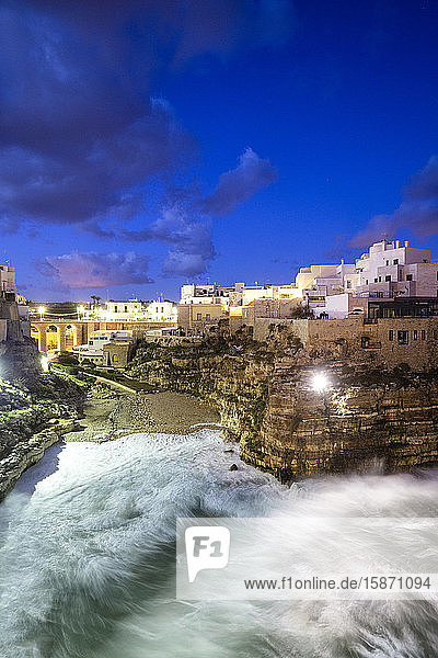 Waves crash on the beach during a winter storm Polignano a Mare Apulia Italy Europe