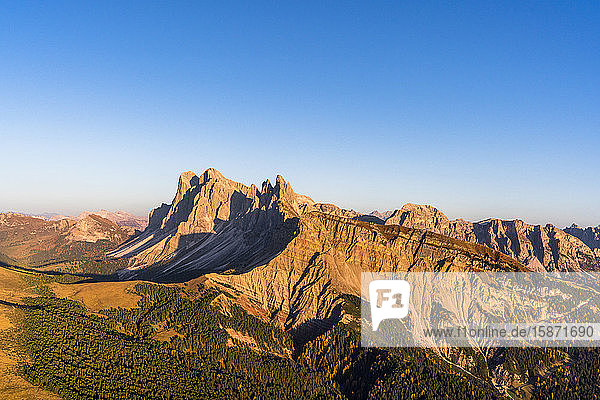 Aerial view of sunset over Seceda mountain in autumn Cisles-Odle Nature Park Dolomites Val Gardena South Tyrol Italy Europe