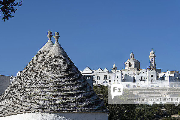 Cone shaped roofs of Trulli outside the historic center of Locorotondo Valle d'Itria Bari district Puglia Italy Europe