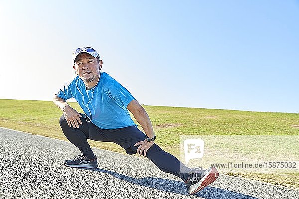Mature Japanese man training downtown