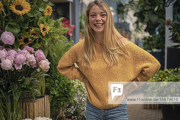 Young woman standing in flower shop