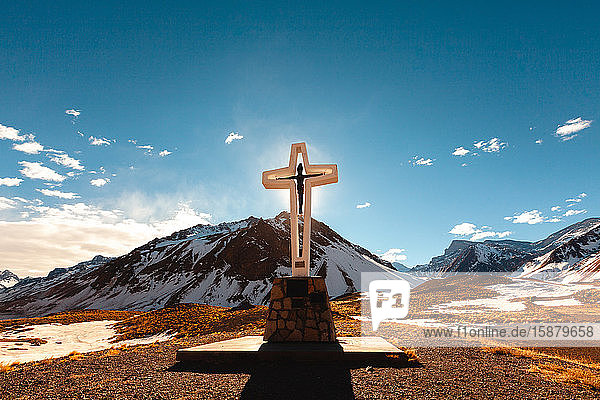 View of cross with mountains
