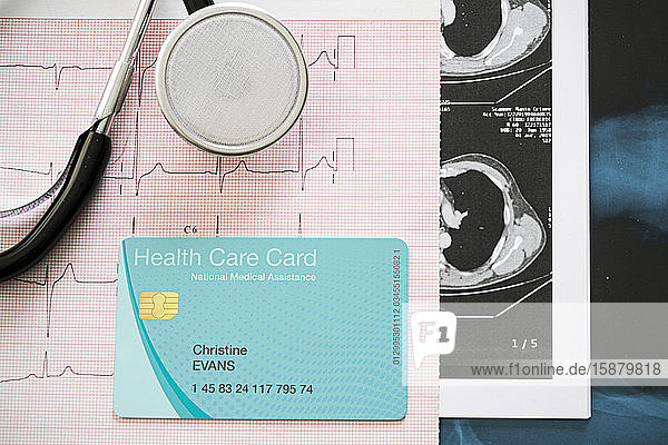 Close up of stethoscope and health care card on medical reports