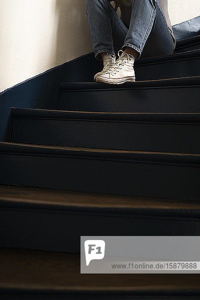 Young woman sitting on steps