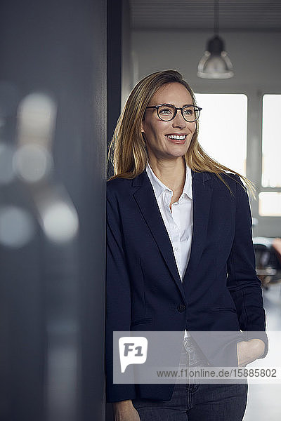 Portrait of happy businesswoman in office