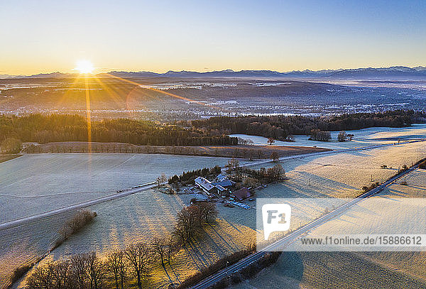 Germany  Bavaria  Icking  Drone view of winter countryside at sunrise