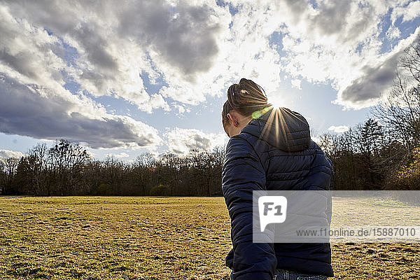 Rear view of girl on a meadow
