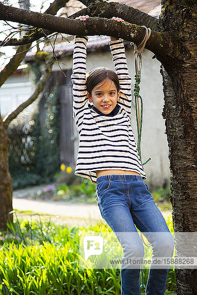 Portrait of smiling girl playing in garden