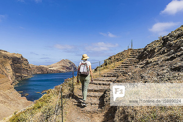 Portugal  Madeira  Female hiker walking up coastal steps at Ponta de Sao Lourenco
