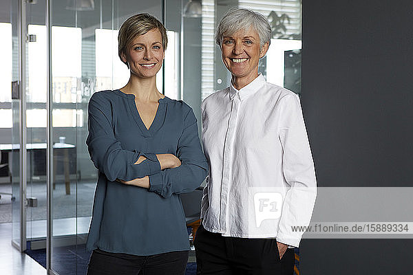 Portrait of two confident businesswomen in office