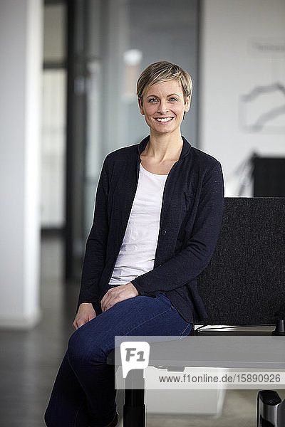Portrait of smiling businesswoman in office