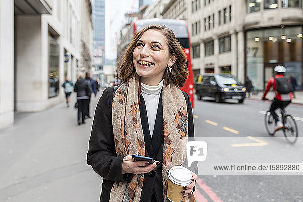 Portrait of happy woman in the city  London  UK