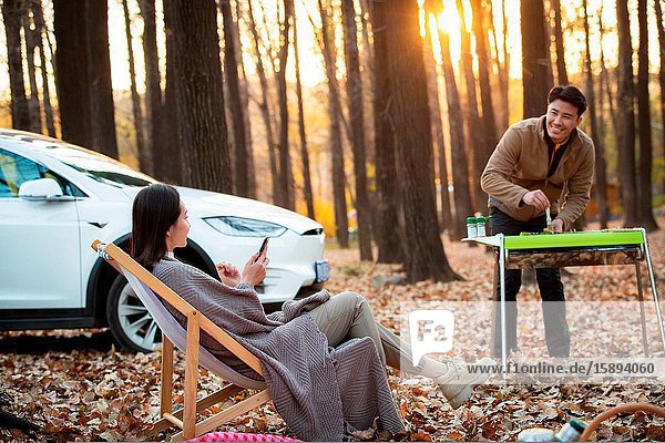 Happy couples in the outdoor camping