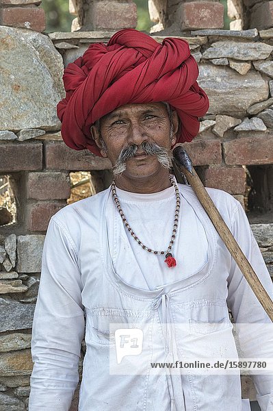 Indian man, member of the Rabari tribe, with a red turban, Bera, Rajasthan, India.