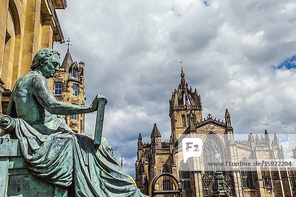 David Hume statue and St Giles' Cathedral or the High Kirk of Edinburgh Royal Mile High Street Old Town Edinburgh Scotland United Kingdom Europe.