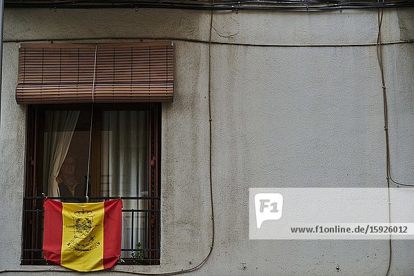 People applaud health care workers from their windows on April 22 2020 in Madrid Spain. Starting last week some businesses deemed non-essential have been allowed to resume operations and it is expected that from April 27 children under 12 will be allowed to come and go from their homes more freely. Spain has had more than 200 000 confirmed cases of COVID-19 and over 20 000 reported deaths although the rate has declined after weeks of lockdown measures.