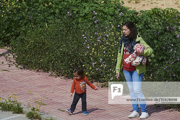 Children play with their parents in the field after 45 days at home without being able to leave as a measure of confinement for the Covid-19 on April 26 2020 in Madrid Spain.Children in Spain which has had one of the stricter lockdowns in Europe are now allowed to leave their homes for up to an hour per day. The country has had more than 220 000 confirmed cases of COVID-19 and over 20 000 reported deaths although the rate has declined after weeks of quarantine measures