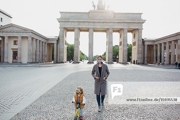 Mother and son walking in Berlin in Corona days.